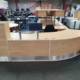 Used Large Reception Desk, front view straight section with curved section, drawer unit and glass shelf