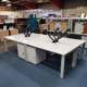 light grey 1600mm bench desks and drawers, side view 2