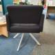 used lounge seating, black armchairs rear view
