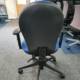 Rear view, blue task chair, height adjustable arms, 3 lever mechanism