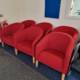 red fabric tub chairs