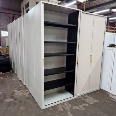 used Tall Tambours with keys and 5 shelves each,excellent condition, closed and open doors
