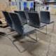 pre-owned grey fabric chairs chrome cantilever frame, back view