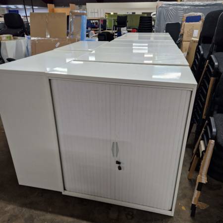 Used 1.2m White Tambour Cabinets, each with 2 shelves