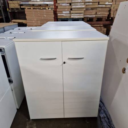 used 1.2m high white wooden 2-door cupboard, doors closed