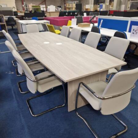Grey wood boardroom table for 10 with optional pop up units, side view